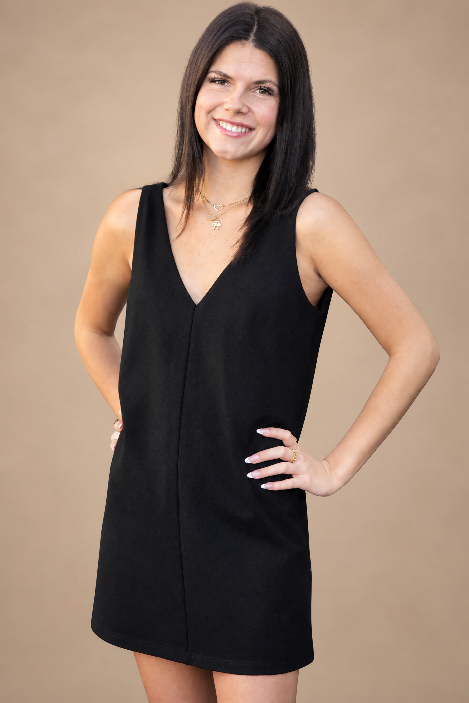 Woman wearing a simple black dress